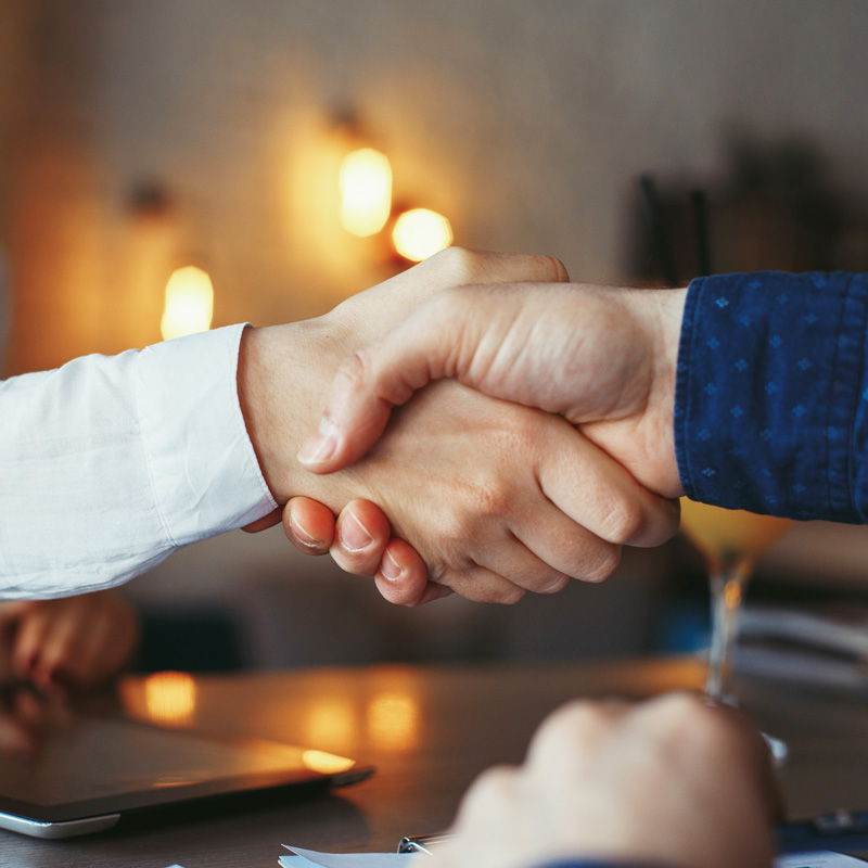 businessman-and-businesswoman-handshake-1 businessman-and-businesswoman-handshake-1